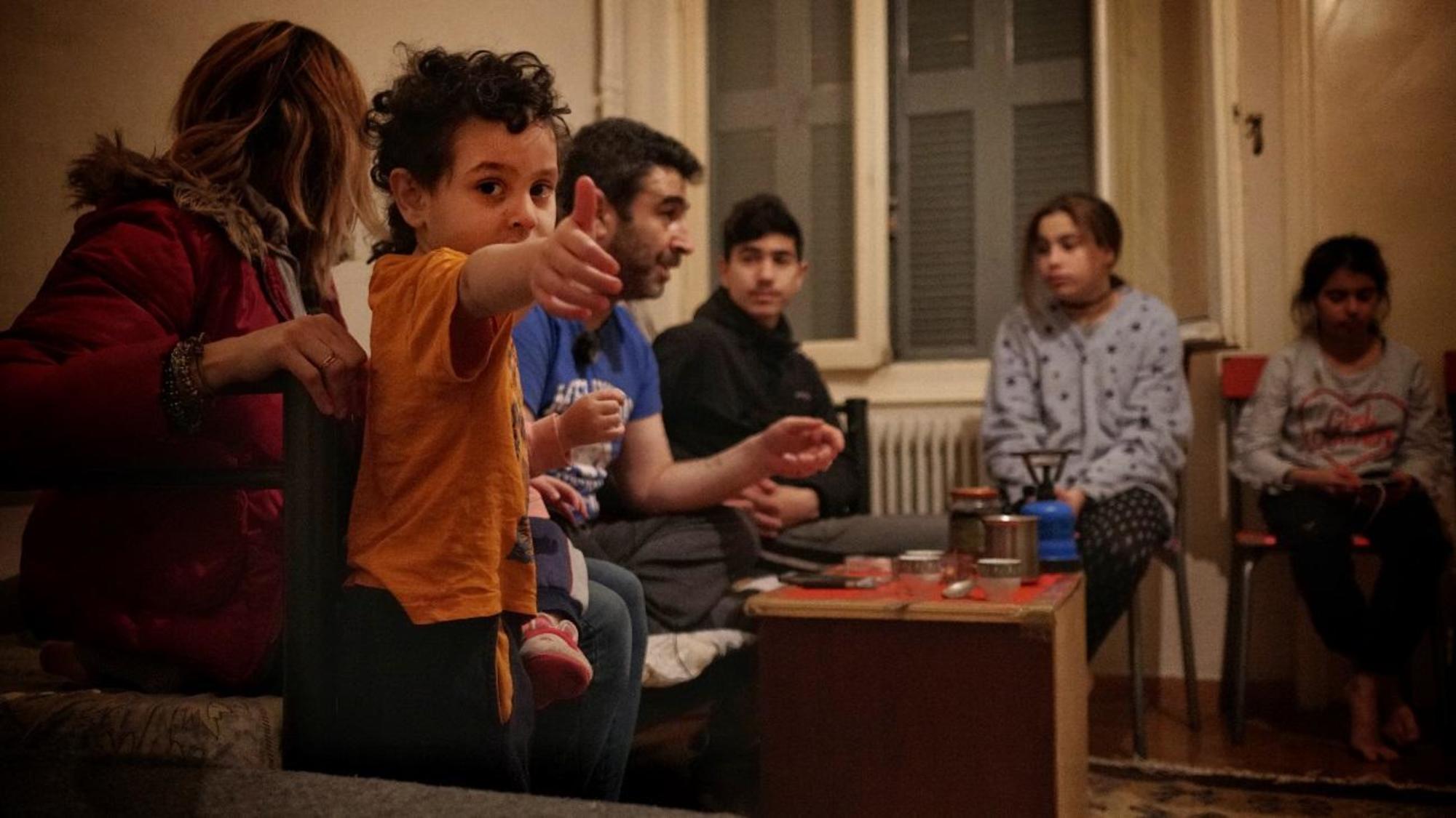 Familia refugiados en Grecia